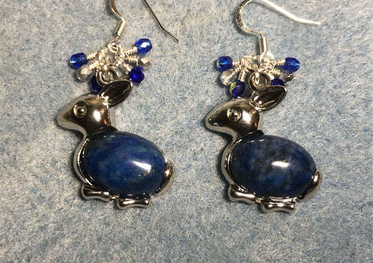 Large silver and blue lapis lazuli gemstone rabbit charm earrings adorned with small dangling blue and silver Czech glass beads.