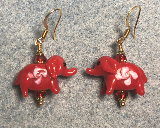 Opaque red and pink lamp work elephant bead earrings adorned with red Chinese crystal beads.