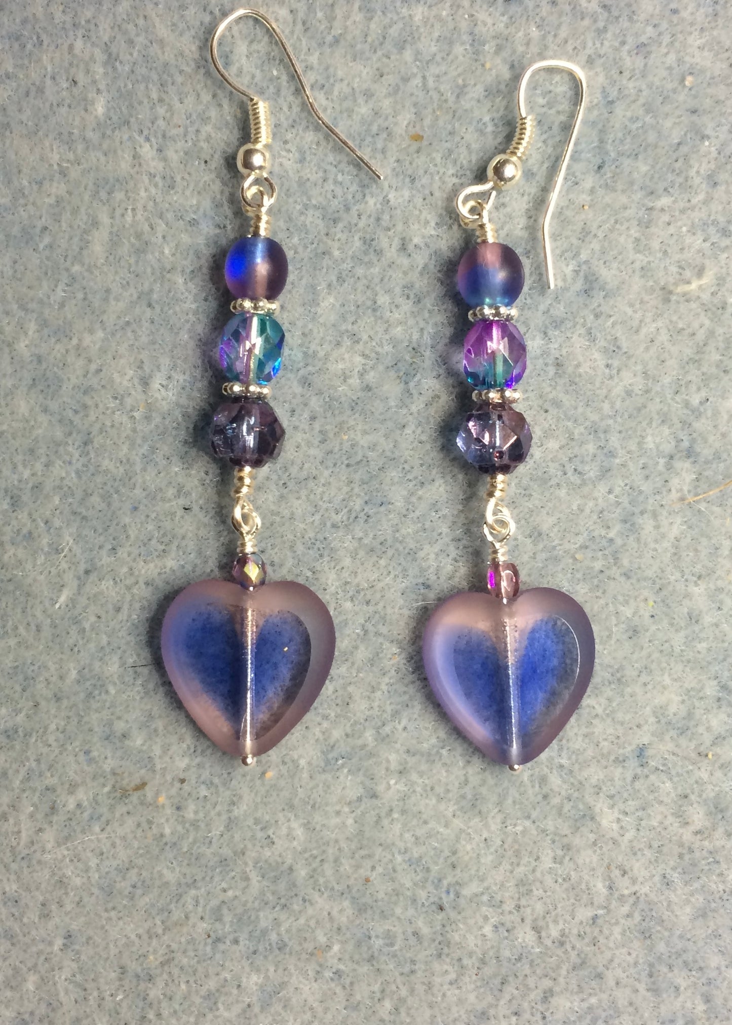 Translucent purple and blue Czech glass heart bead earrings adorned with purple and blue Czech glass beads.