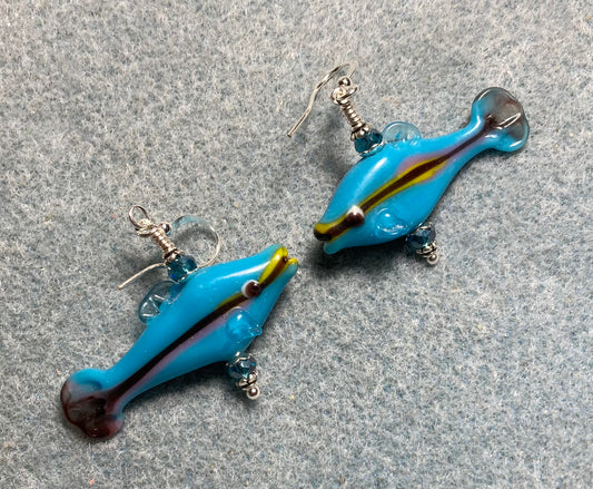 Turquoise lamp work fish bead earrings adorned with turquoise Chinese crystal beads.