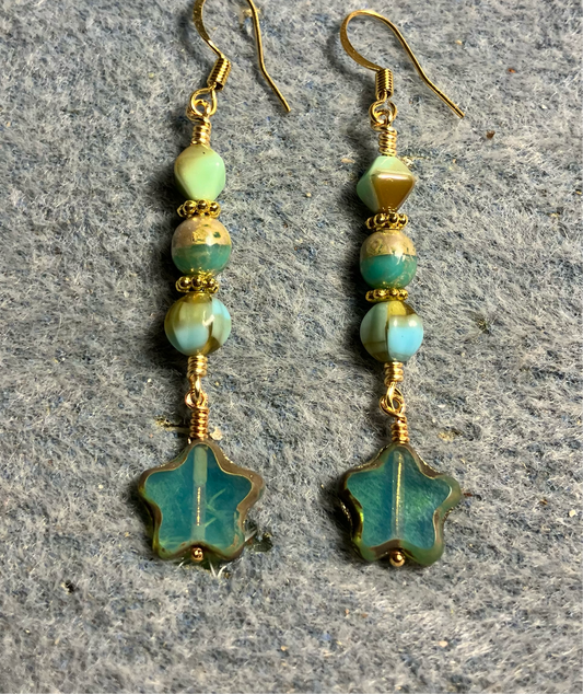 Small light teal Czech glass star bead earrings adorned with teal and tan Czech glass beads.