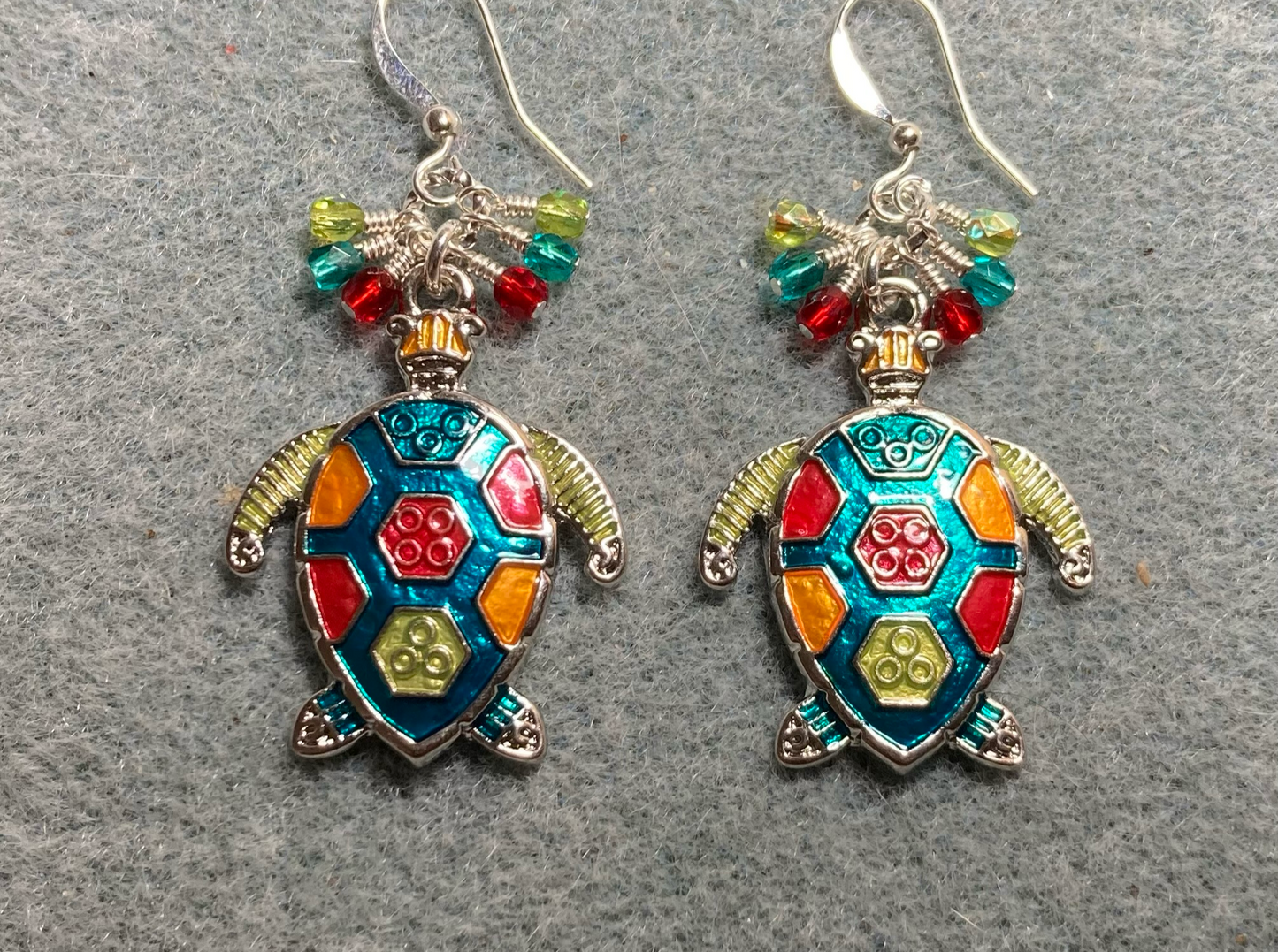 Large lime green, turquoise, and red enamel sea turtle charm earrings adorned with small dangling lime green, turquoise, and red Chinese crystal beads.