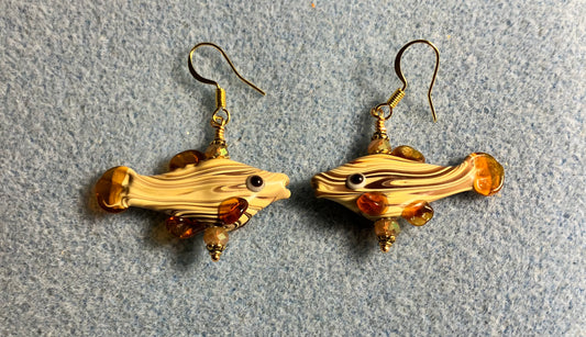 Tan lamp work striped fish bead earrings adorned with tan Chinese crystal beads.