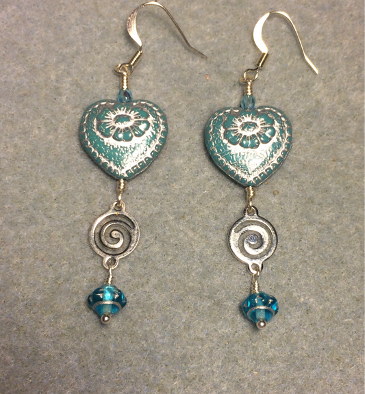 Opaque turquoise (with silver inlay) Czech glass heart bead earrings adorned with silver swirly links and turquoise Czech glass Saturn beads.