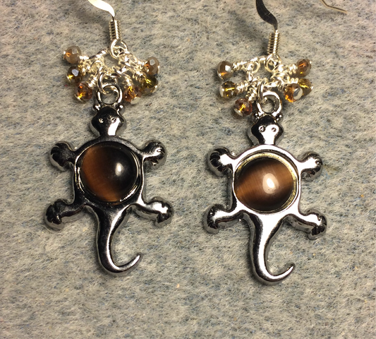 Silver and brown fiber optic lizard charm earrings adorned with small dangling amber and brown Chinese crystal beads.