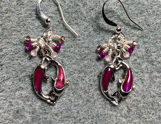 Small bright pink paua abalone pair of dolphin charm earrings adorned with tiny dangling pink, hot pink, and violet Chinese crystal beads.