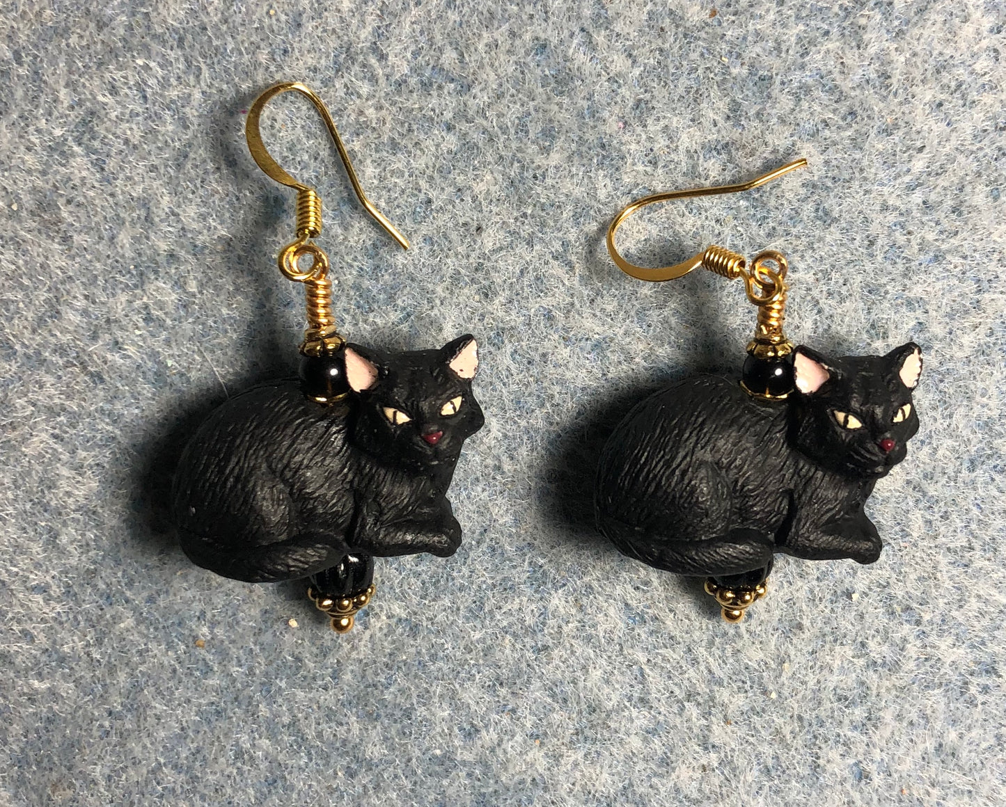 Black ceramic cat bead earrings adorned with black Czech glass beads.