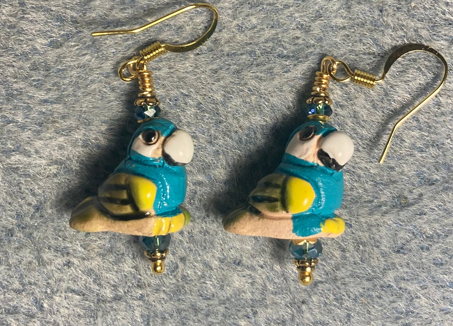 Small turquoise and yellow ceramic parrot bead earrings adorned with turquoise Chinese crystal beads.