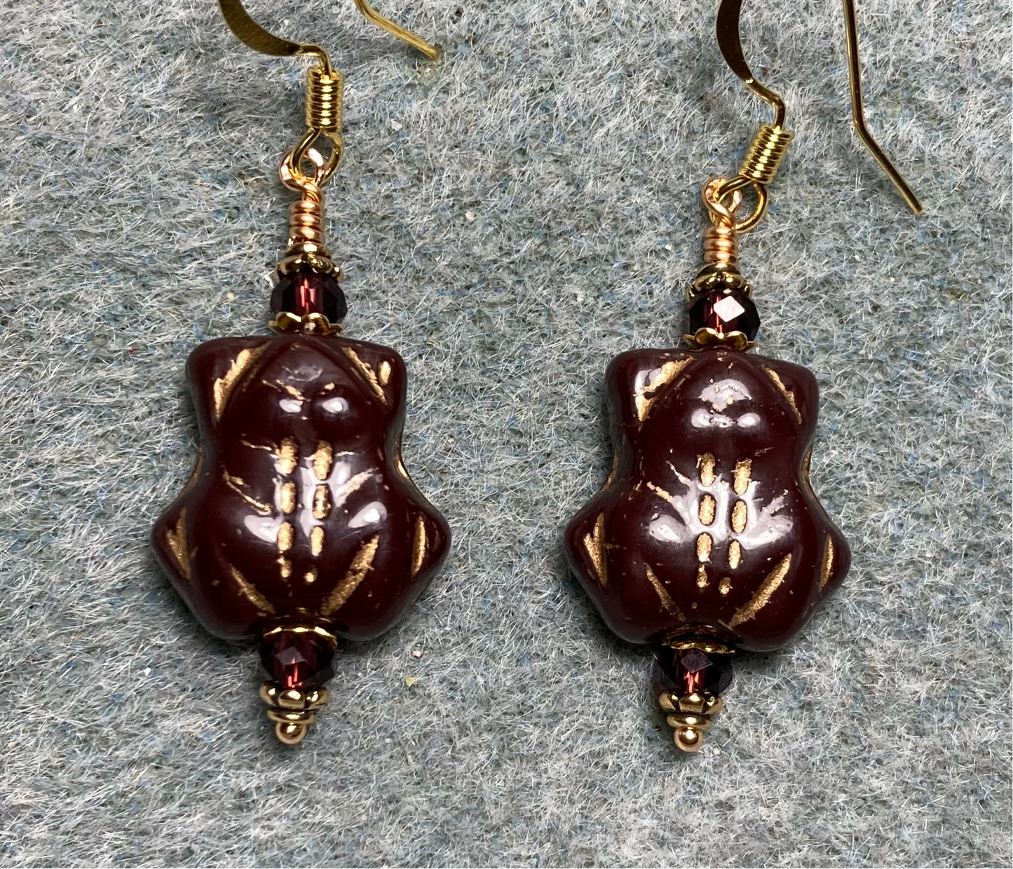 Opaque purple (with gold inlay) Czech glass frog bead earrings adorned with purple Chinese crystal beads.