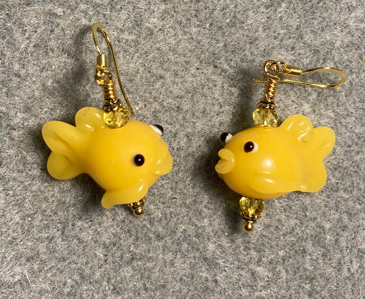 Yellow lamp work fish bead earrings adorned with yellow Chinese crystal beads.
