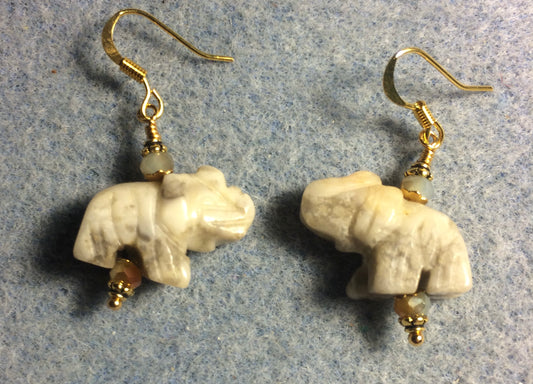 Off white yellow crazy agate gemstone elephant bead earrings adorned with tan Chinese crystal beads.