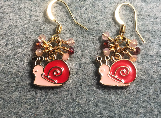 Small red and pink enamel snail charm earrings adorned with tiny dangling red and pink Chinese crystal beads.