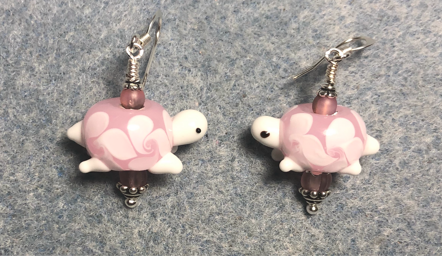 Light pink lamp work turtle bead earrings adorned with light pink Czech glass beads.