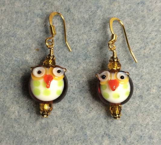 Small topaz and green lamp work owl bead earrings adorned with topaz Chinese crystal beads.