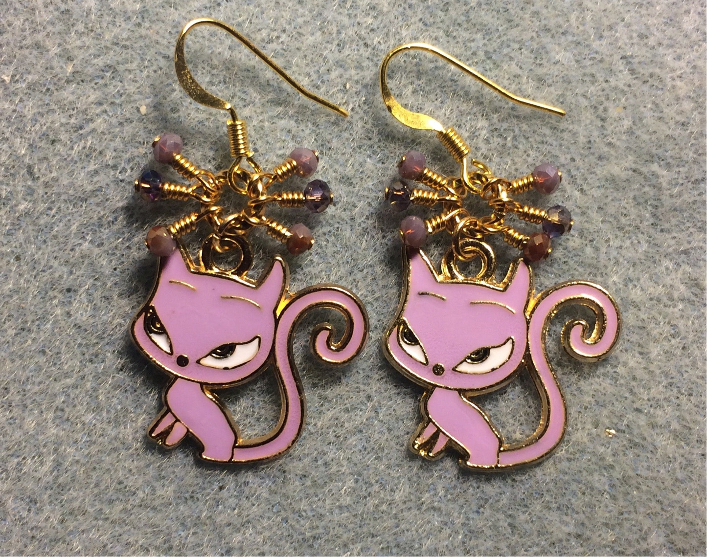Purple, gold, and white enamel fox (or devil cat) charm earrings adorned with tiny dangling purple and gold Chinese crystal beads.