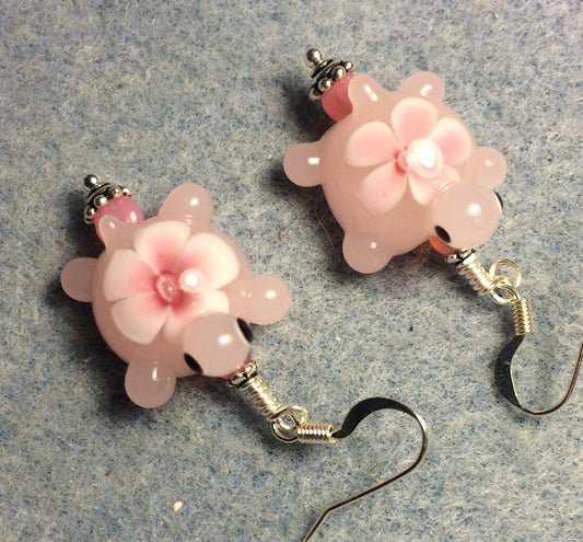 Pink lamp work turtle bead earrings adorned with pink Czech glass beads.