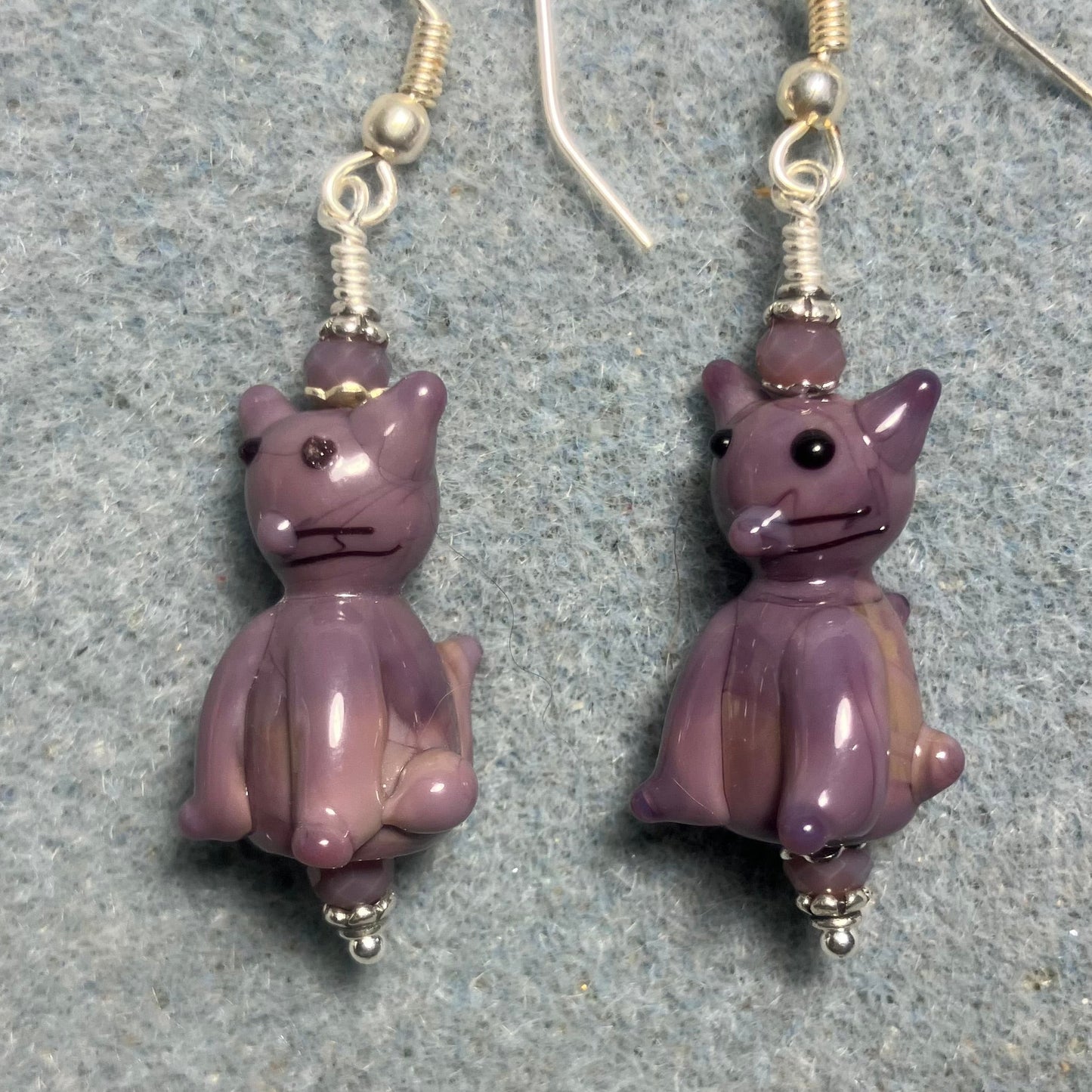 Opaque violet lamp cat bead earrings adorned with violet Chinese crystal beads.