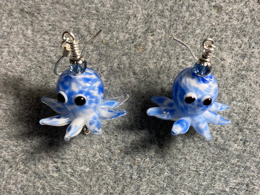 Blue and white mottled lamp work octopus bead earrings adorned with light blue Chinese crystal beads.