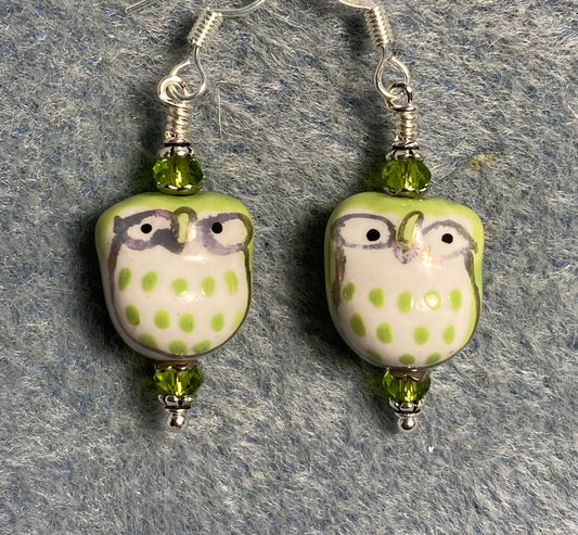 Olive green ceramic spotted owl bead earrings adorned with olive green Chinese crystal beads.