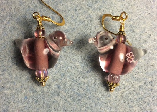Translucent lavender lamp work songbird bead earrings adorned with lavender Czech glass beads.