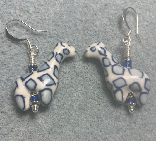 Dark blue and white ceramic spotted giraffe bead earrings adorned with small dark blue Czech glass beads.