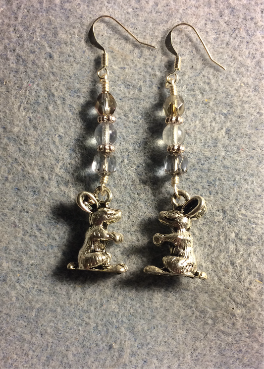 Silver sitting rabbit charm earrings adorned with light blue Czech glass beads