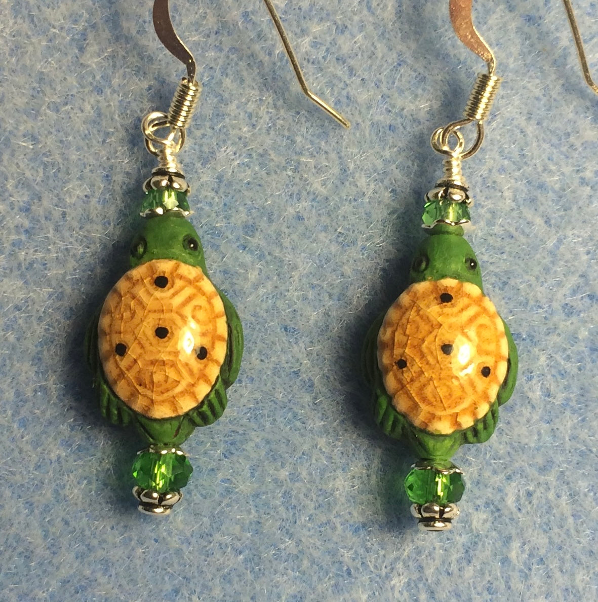 Small green and tan ceramic turtle bead earrings adorned with green Chinese crystal beads.