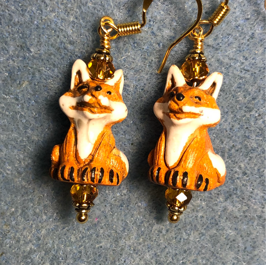 Small amber and white ceramic fox bead earrings adorned with amber Chinese crystal beads.