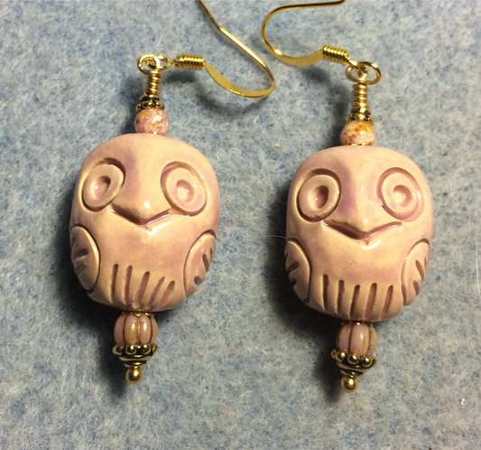 Peach ceramic owl bead earrings adorned with peach pink Czech glass beads.
