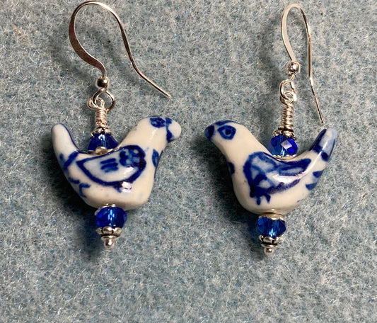 Small dark blue and white ceramic bird bead earrings adorned with dark blue Chinese crystal beads.