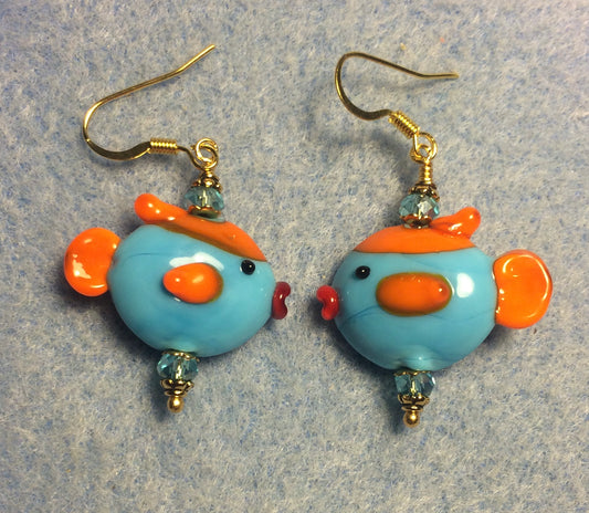 Light turquoise, orange, and red lamp work fish bead earrings adorned with light turquoise Chinese crystal beads.
