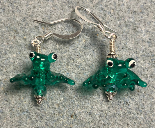 Tiny shiny teal lamp work frog bead earrings adorned with tiny teal Chinese crystal beads.