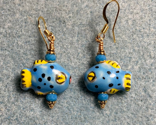 Small blue and yellow ceramic fish bead earrings adorned with blue Chinese crystal beads.