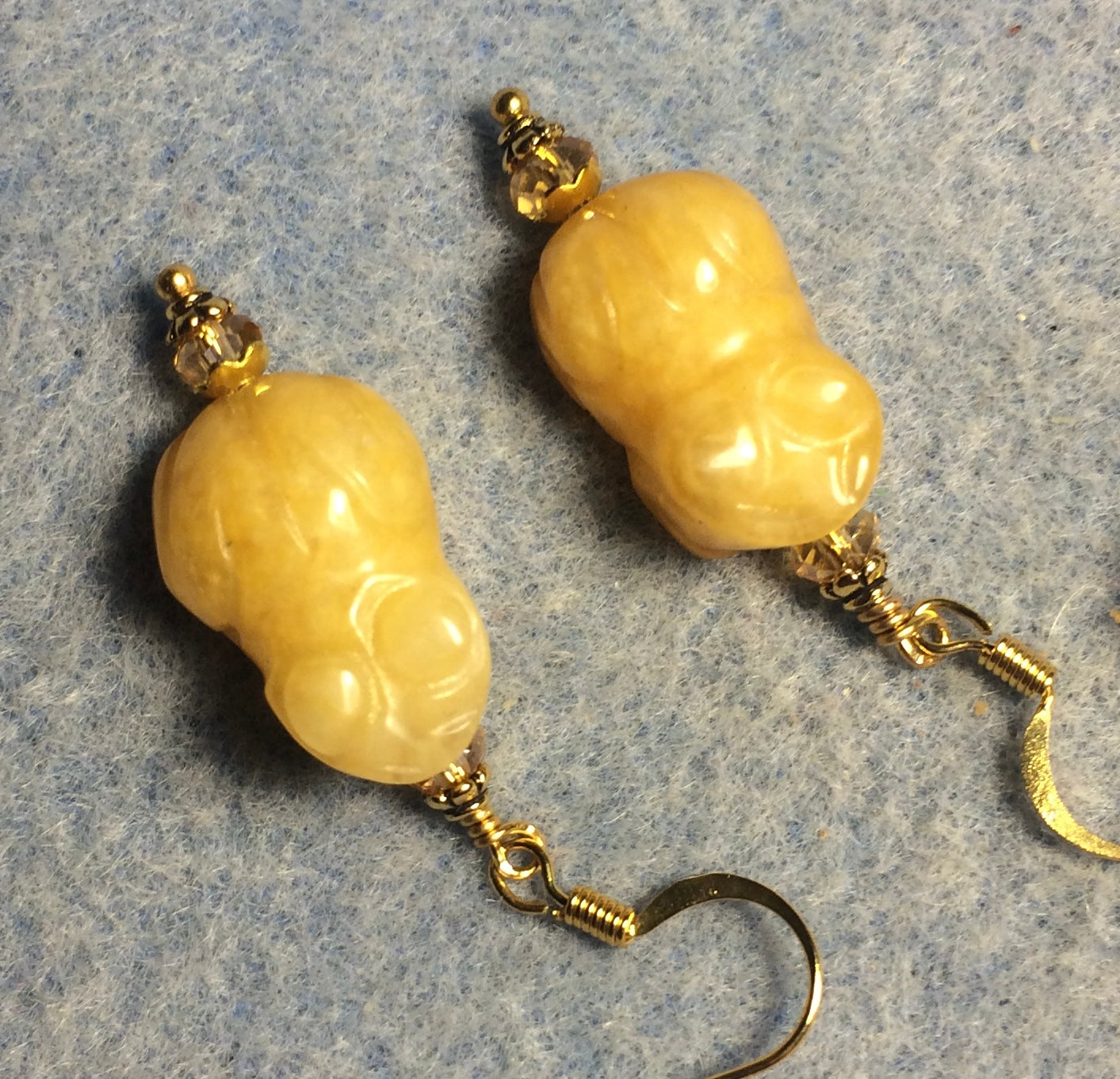 Yellow jadeite gemstone frog bead earrings adorned with amber Chinese crystal beads.