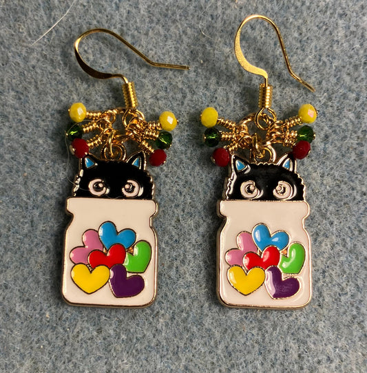 White, black, red, yellow, and green enamel cat charm earrings adorned with tiny dangling red, yellow, and green Chinese crystal beads.
