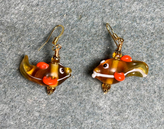 Amber and orange lamp work fish bead earrings adorned with amber Chinese crystal beads.