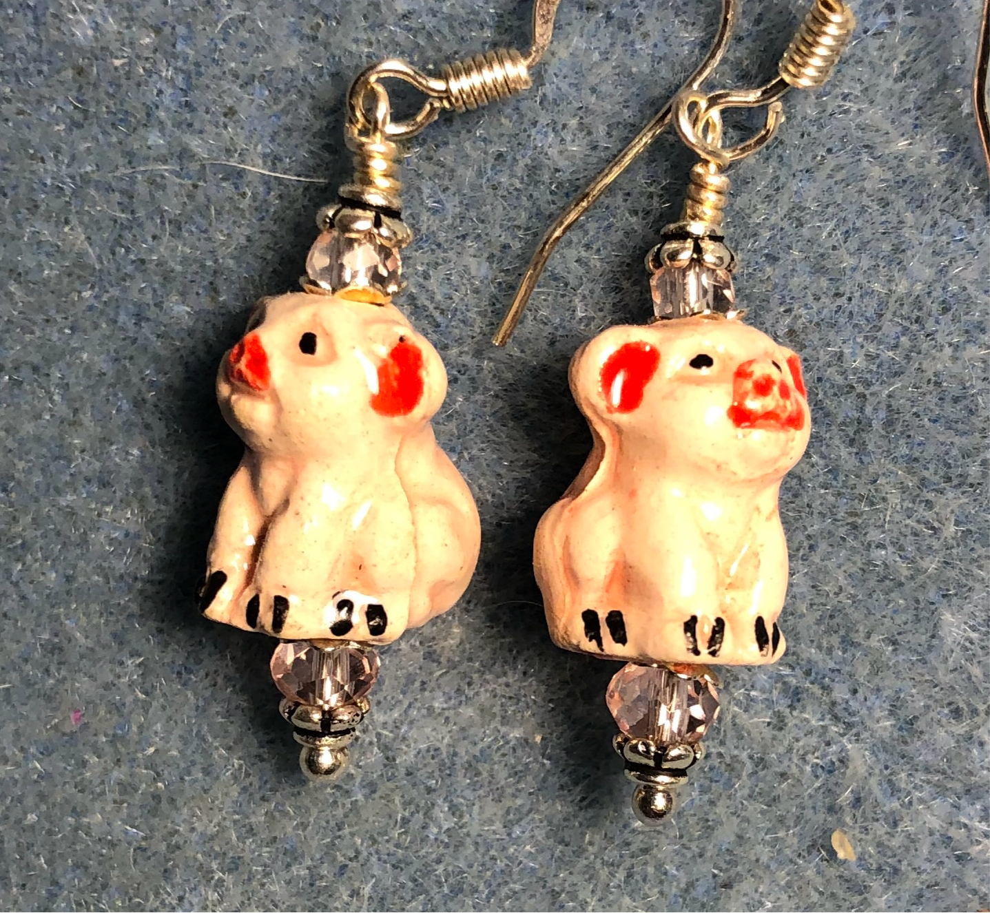 Small white and pink ceramic pig bead earrings adorned with pink Chinese crystal beads.