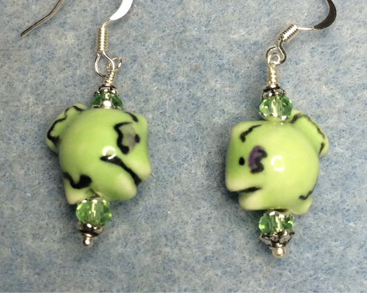 Small green ceramic fish bead earrings adorned with green Chinese crystal beads.