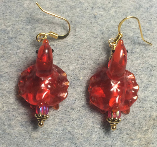 Vintage translucent red lamp work turtle bead earrings adorned with red Czech glass beads.