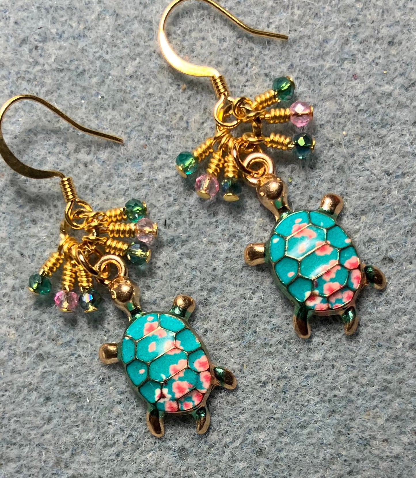 Turquoise and pink enamel turtle charm earrings adorned with tiny dangling turquoise and pink Chinese crystal beads.