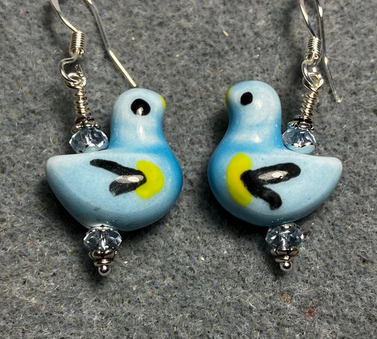 Light blue, black, and yellow ceramic duck bead earrings adorned with light blue Chinese crystal beads.