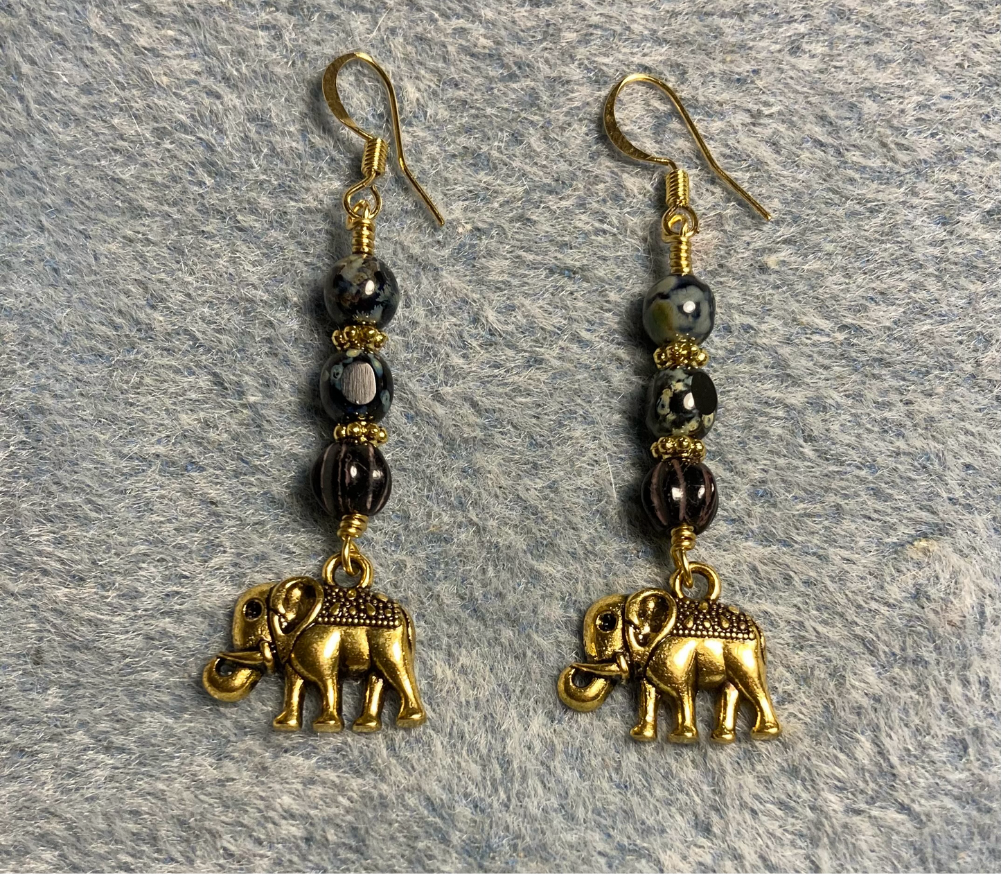 Gold elephant charm earrings adorned with black Picasso Czech glass beads