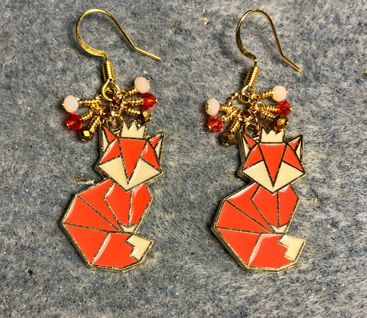 Orange and off white enamel origami fox charm earrings adorned with tiny dangling orange, off white, and gold Chinese crystal beads.
