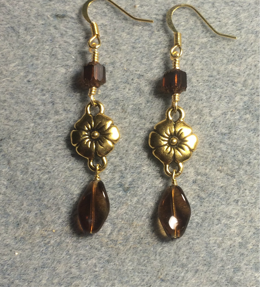 Gold Tierracast flower connector charm earrings adorned with brown Czech glass twist beads and brown Czech glass beads.