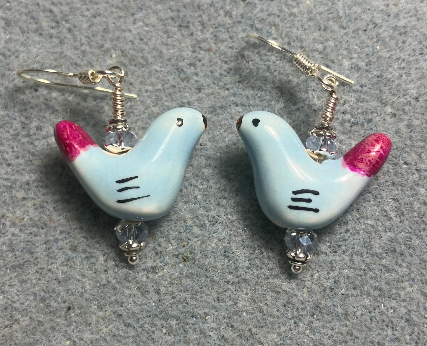 Small light blue and hot pink ceramic bird bead earrings adorned with light blue Chinese crystal beads.