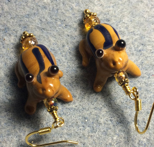 Brown and blue lamp work striped frog bead earrings adorned with amber Czech glass beads.