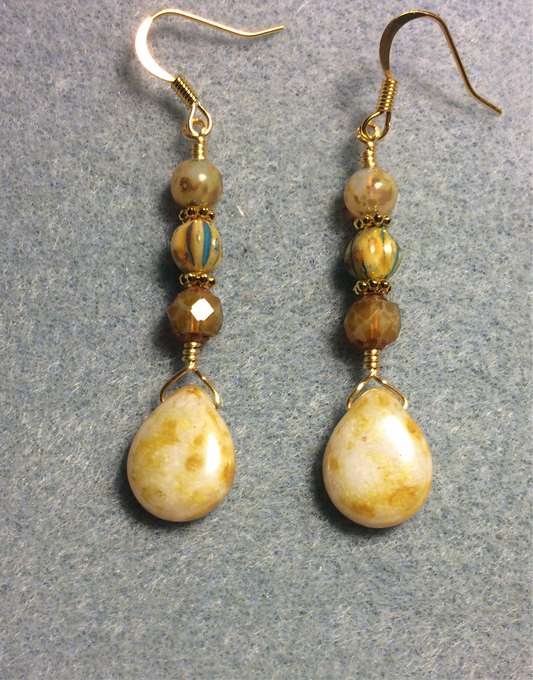 Beige yellow Czech glass pear drop bead earrings adorned with beige yellow Czech glass beads.