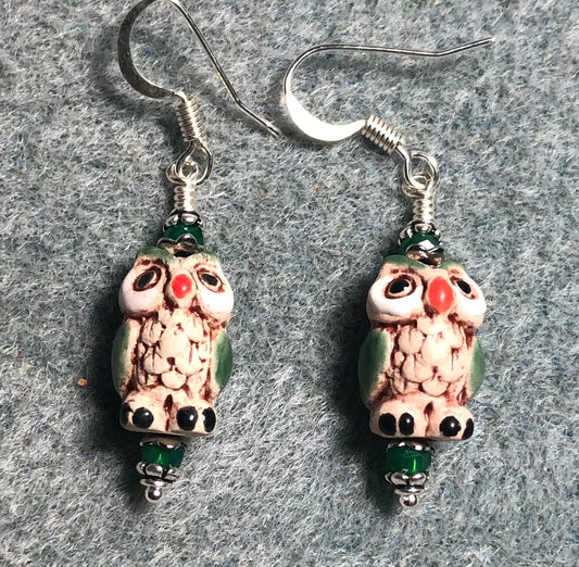 Small tan, red, and green ceramic owl bead earrings adorned with green Chinese crystal beads.
