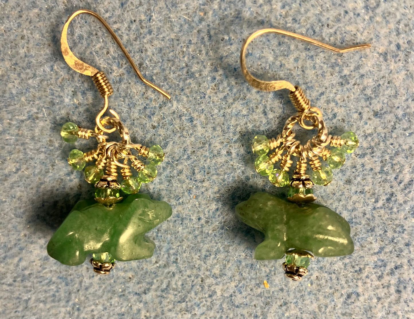 Small green aventurine gemstone frog bead earrings adorned with tiny dangling green Chinese crystal beads.