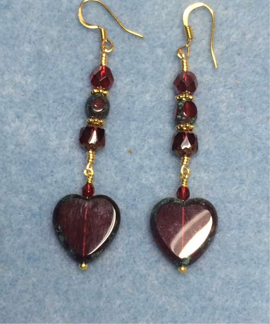 Dark red Czech glass heart bead earrings adorned with dark red Czech glass beads.